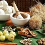 Ayurvedic medicine herbs and ancient texts with Indian background